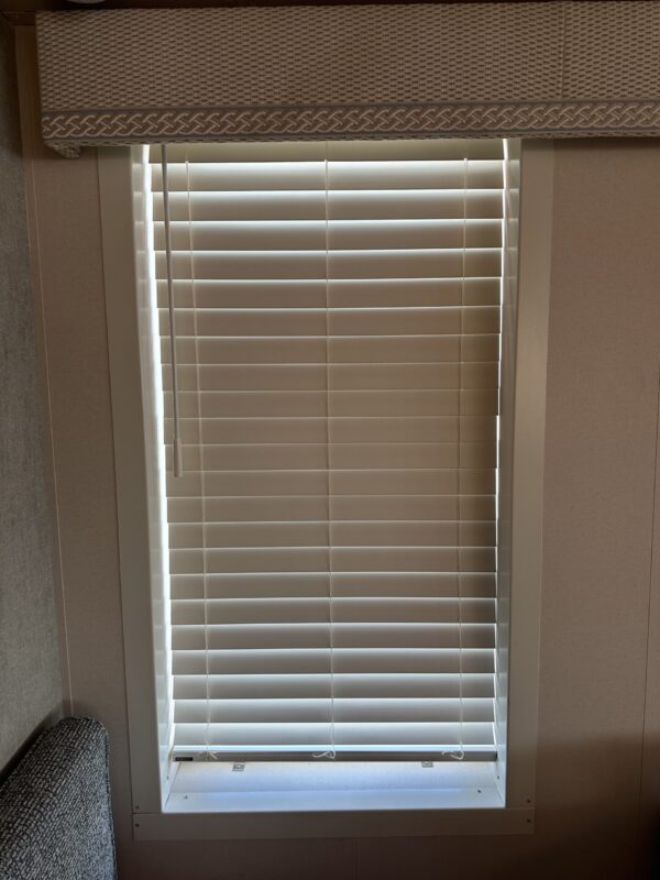 Venetian blinds closed over window