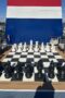 Large outdoor chess board with pieces about two feet tall