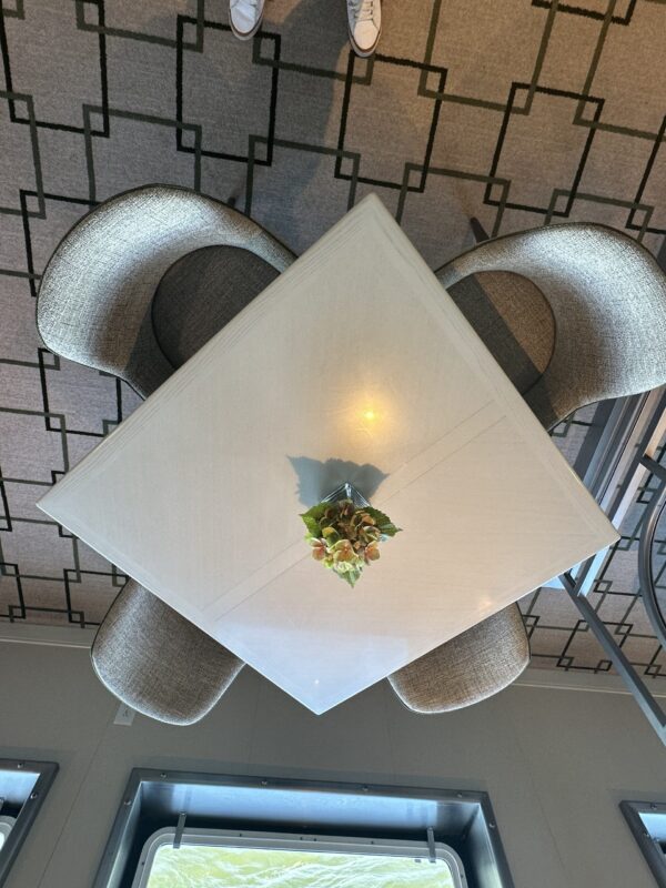 White square dining table viewed from above