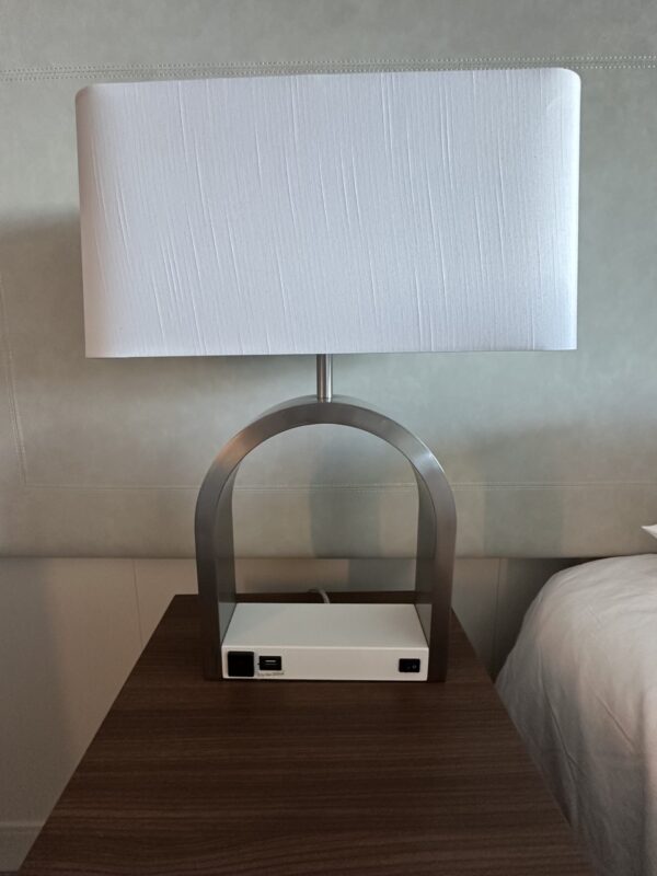 white base table lamp with silver metal arch and white rectangular shade