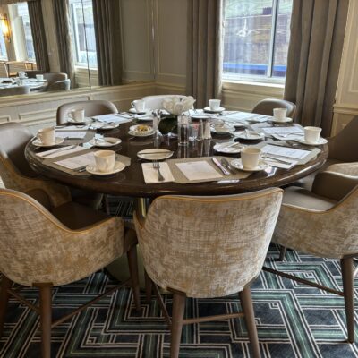 8-Top Round Dining Table with a Brass Base